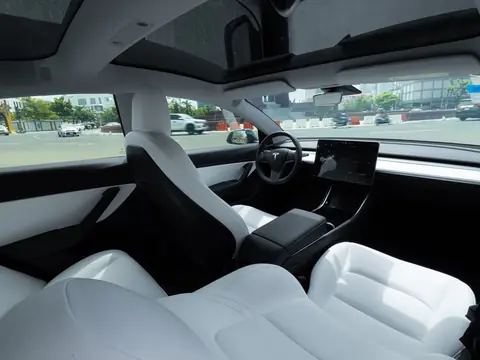 Light leather cabin with a large windshield and side glass