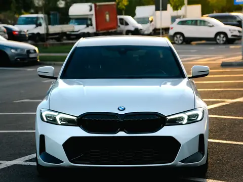 White sedan in a parking lot